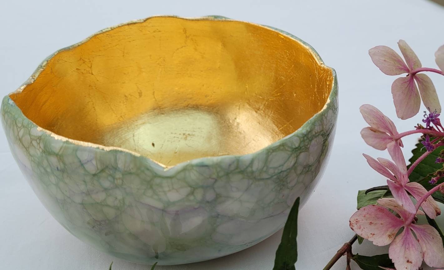 Large garden design glow bowl with rose gold gilding.