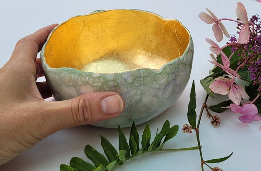 Large garden design glow bowl with rose gold gilding.